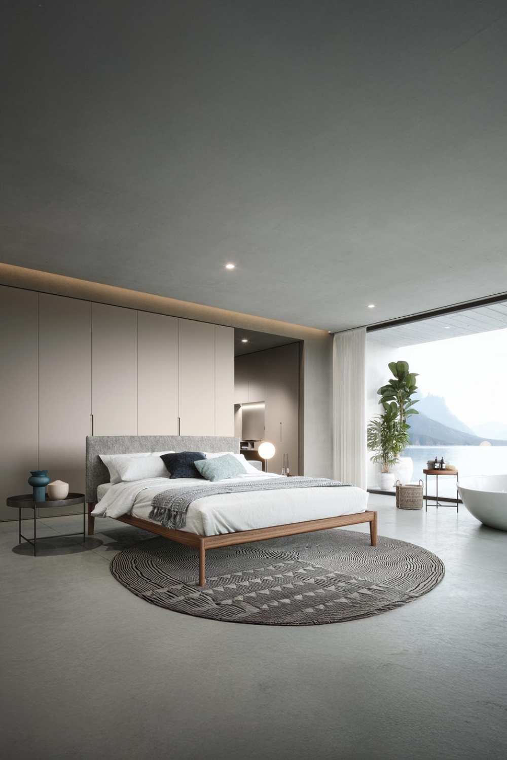lit-et-armoire-au-design-lin&eacute;aire-dans-une-chambre-spacieuse-avec-une-grande-fen&ecirc;tre